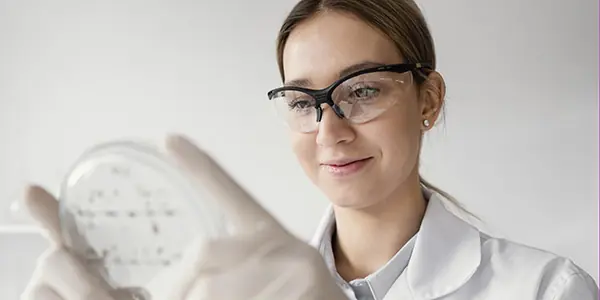 scientist holding dish